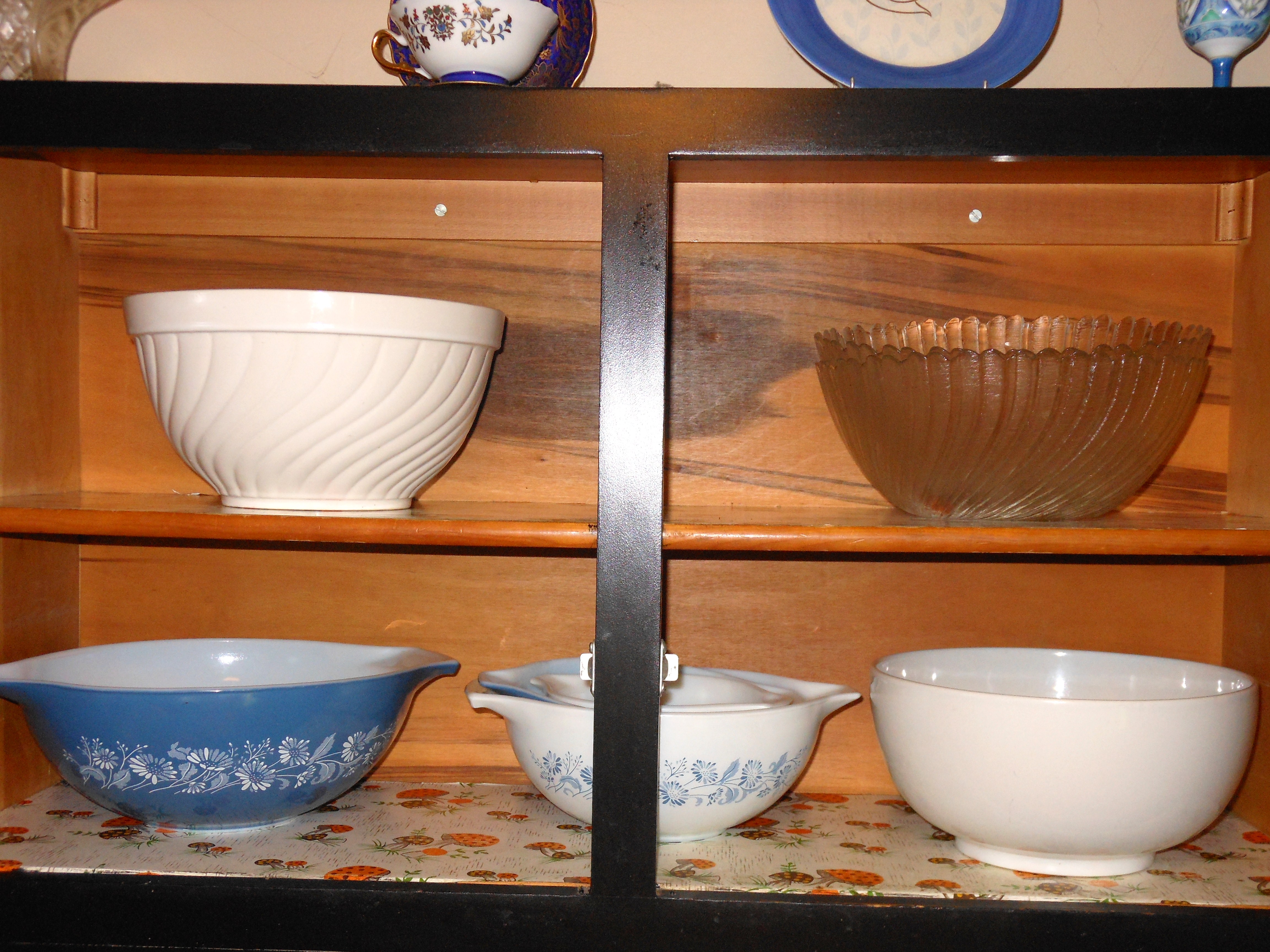 Photo of dishware in overhead cabinet